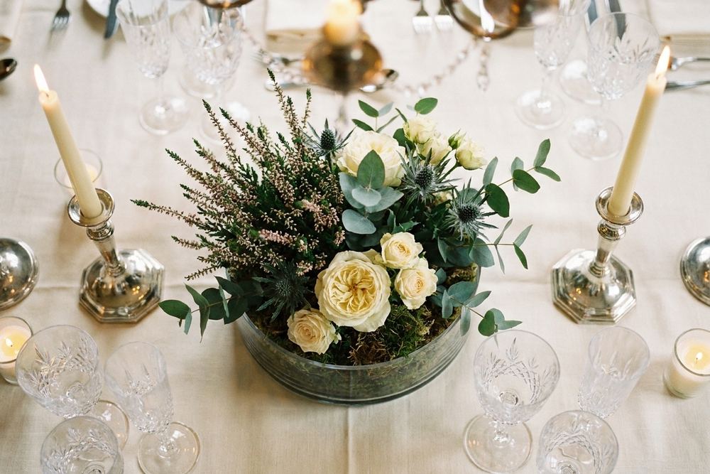 [DRAFT] A table centerpiece at a formal event setting.